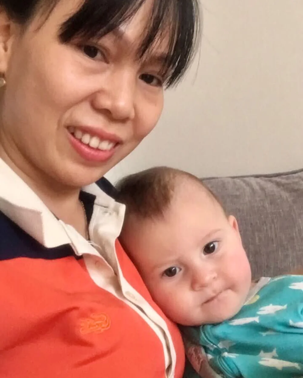 Trang with a baby she cares for in Hoi An
